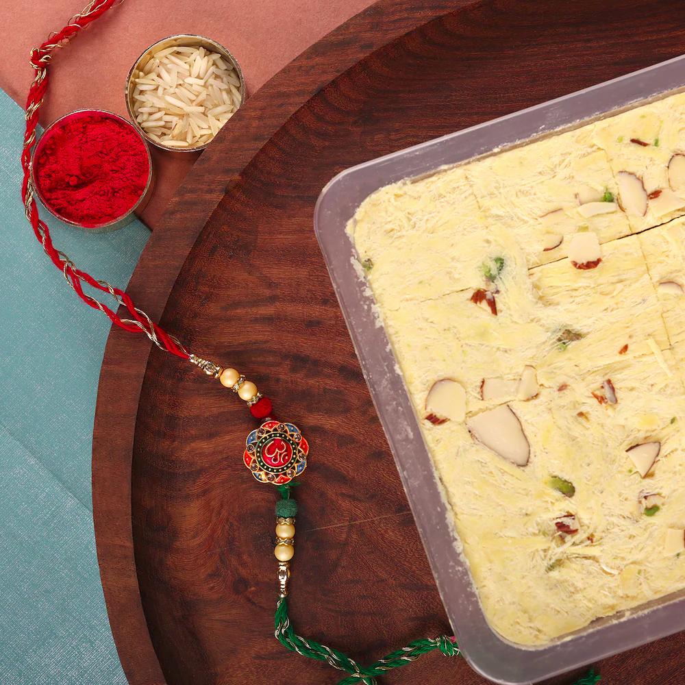  Colourful Om Rakhi With Soan Papdi Hamper